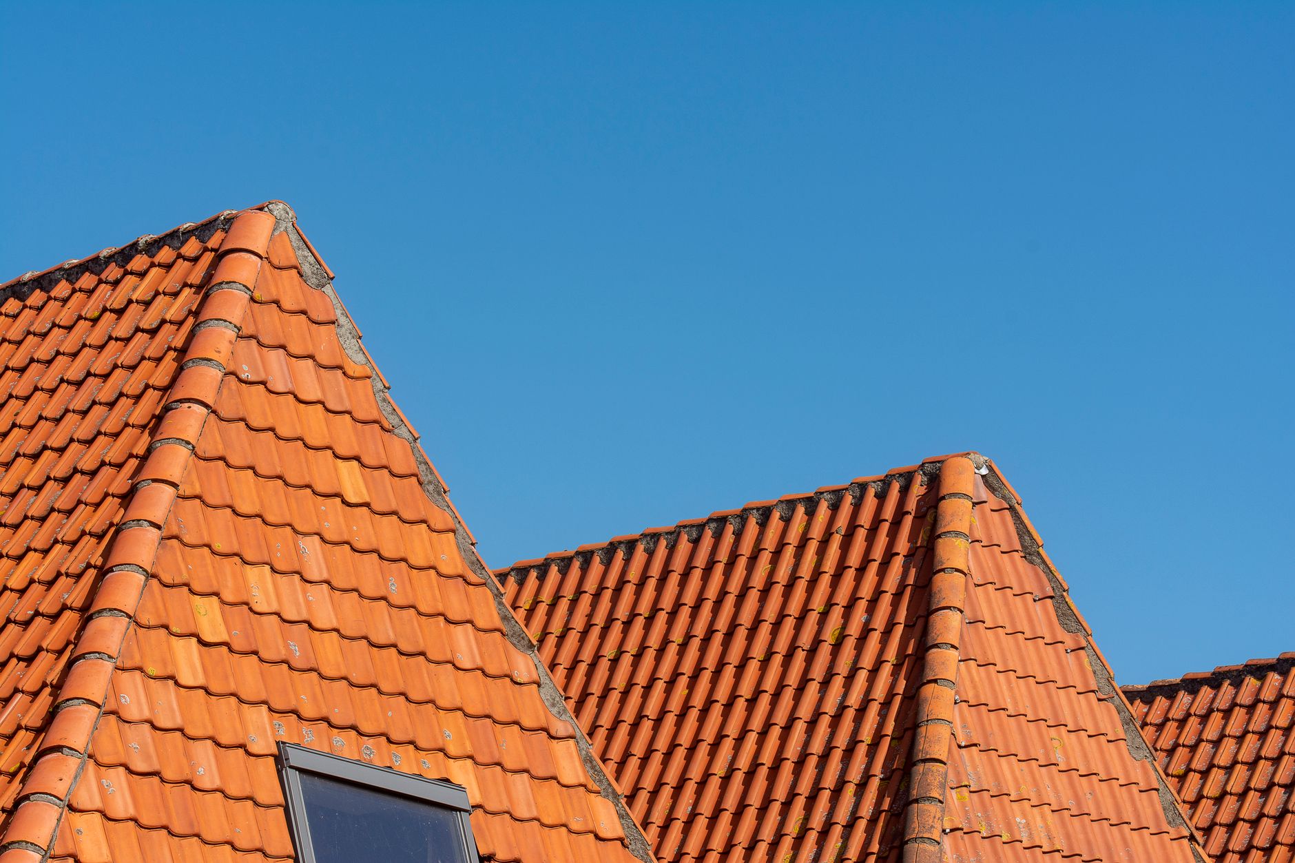 Exterior rooflines under a clear blue sky